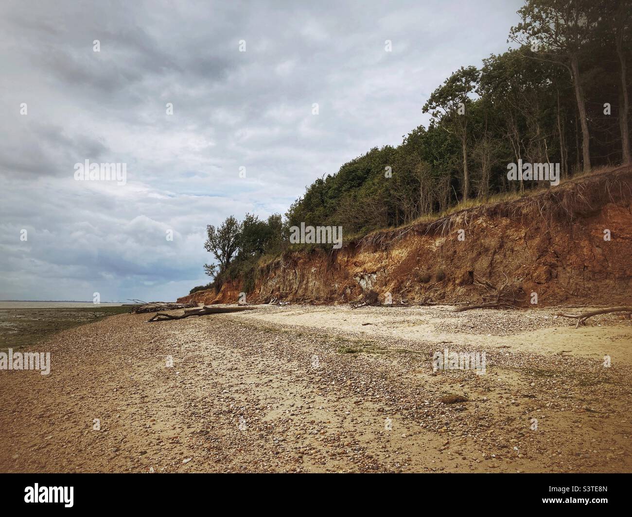An eroded cliff and beach at East Mersea in Essex U.K. - Smartphone Captured Stock Image