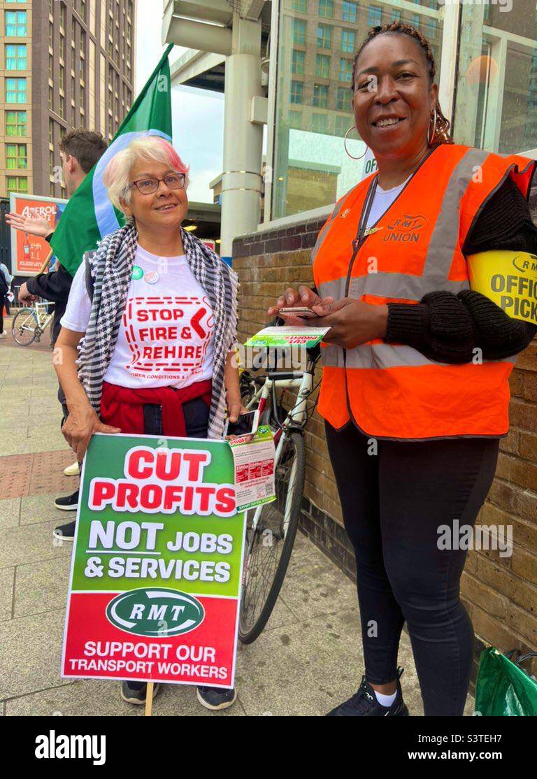 Picket Line outside Lewisham station in London during RMT dispute June 2022 - official picket armband and placard from trade union - Smartphone Captured Stock Image