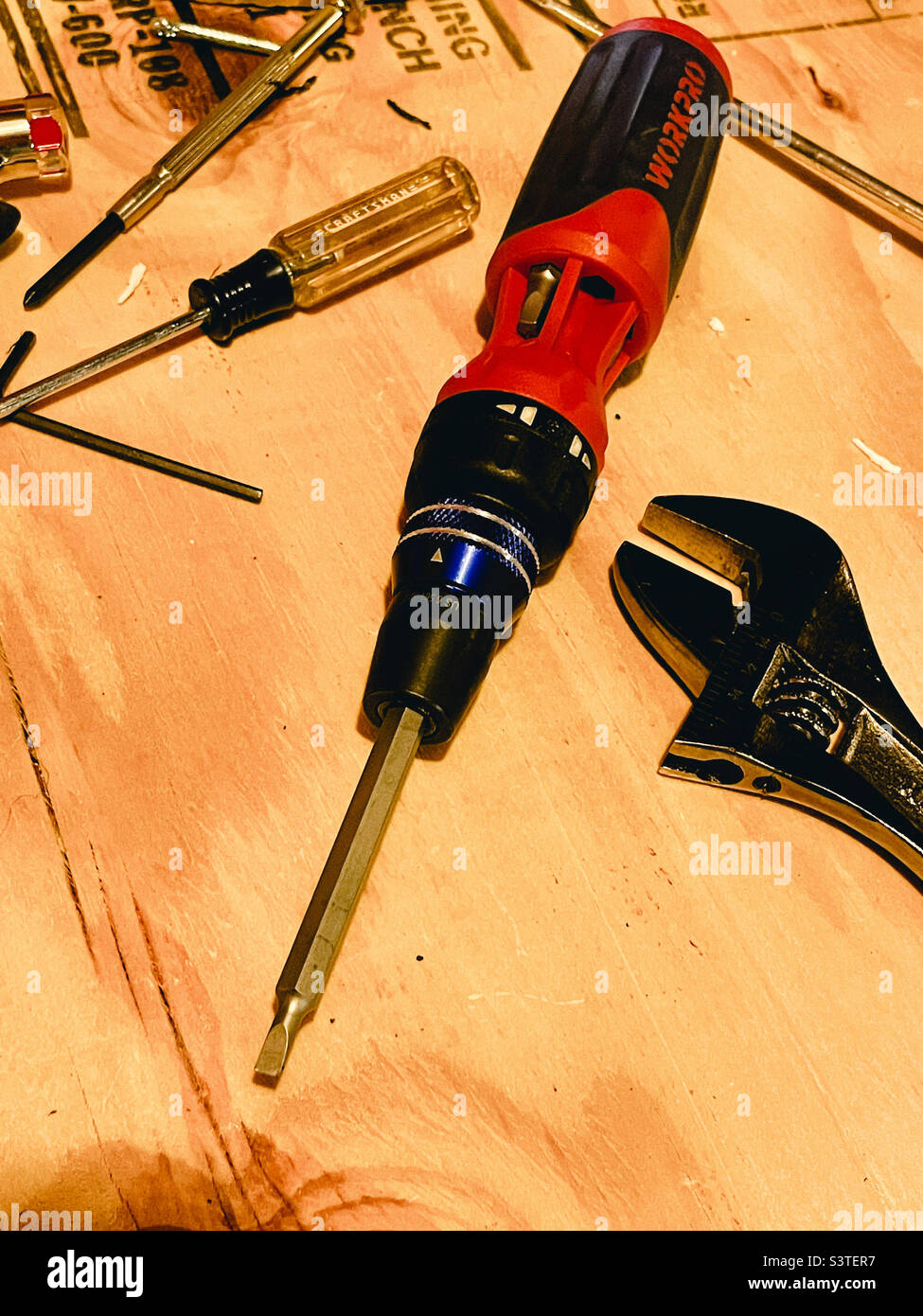 Tools on a wooden workbench in a suburban home, 2022, USA - Smartphone Captured Stock Image