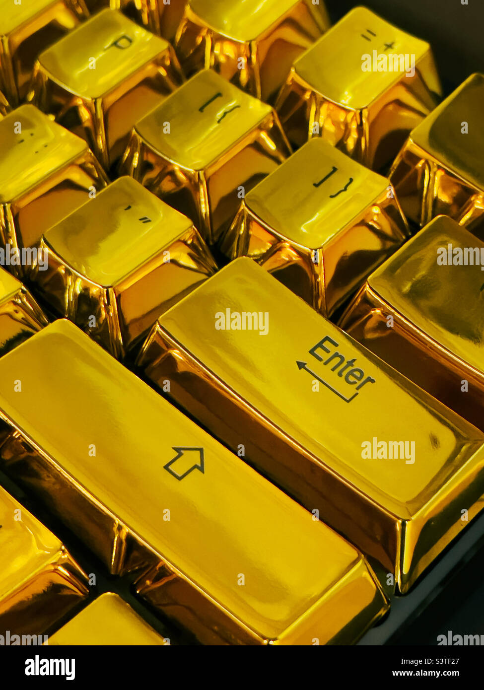 Enter key on a golden keyboard - Smartphone Captured Stock Image