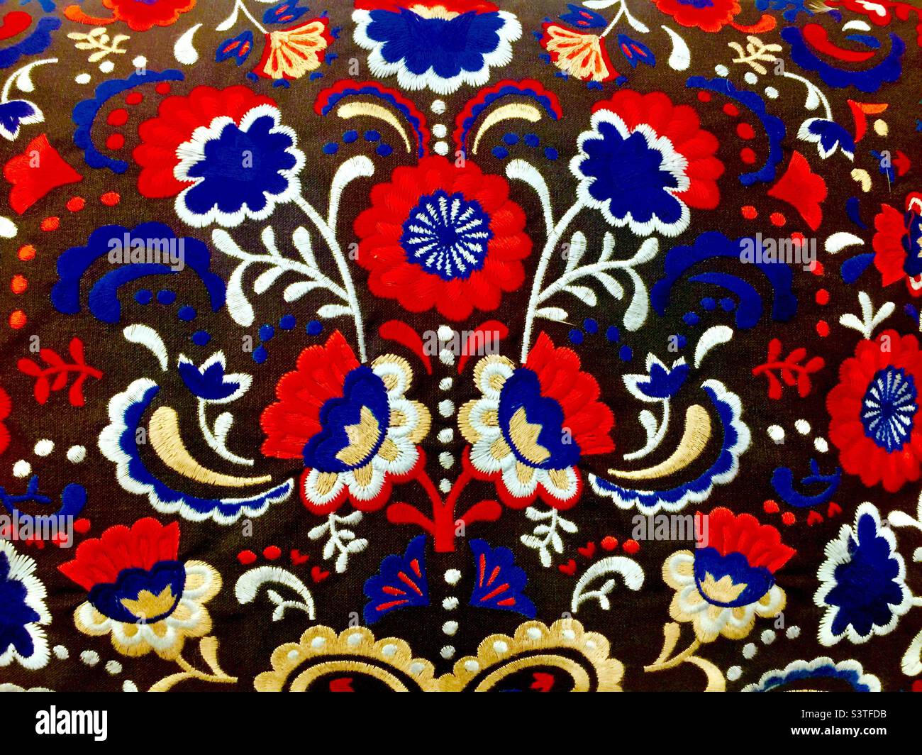 Floral design in many colours on a cushion cover. Inspired by nature. - Smartphone Captured Stock Image