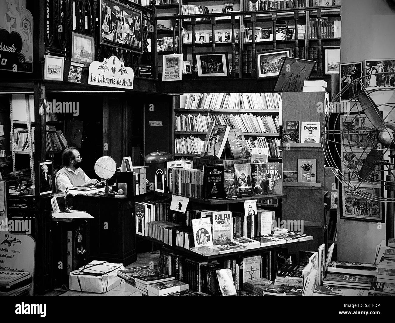 Man at the bookshelf in Argentina Stock Photo