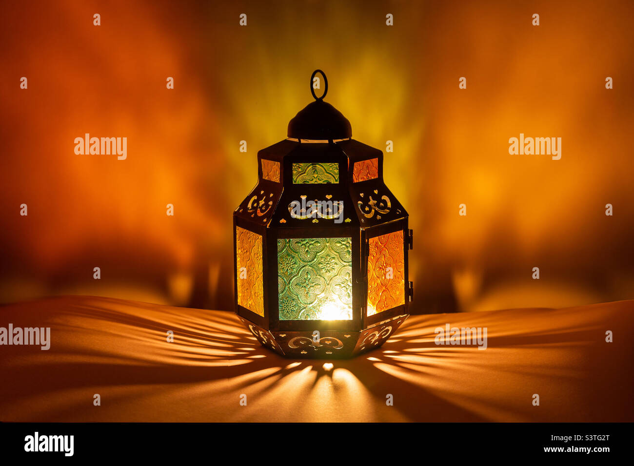 Lit up lantern in the evening. Ramadan Kareem and Eid Mubarak. Stock Photo