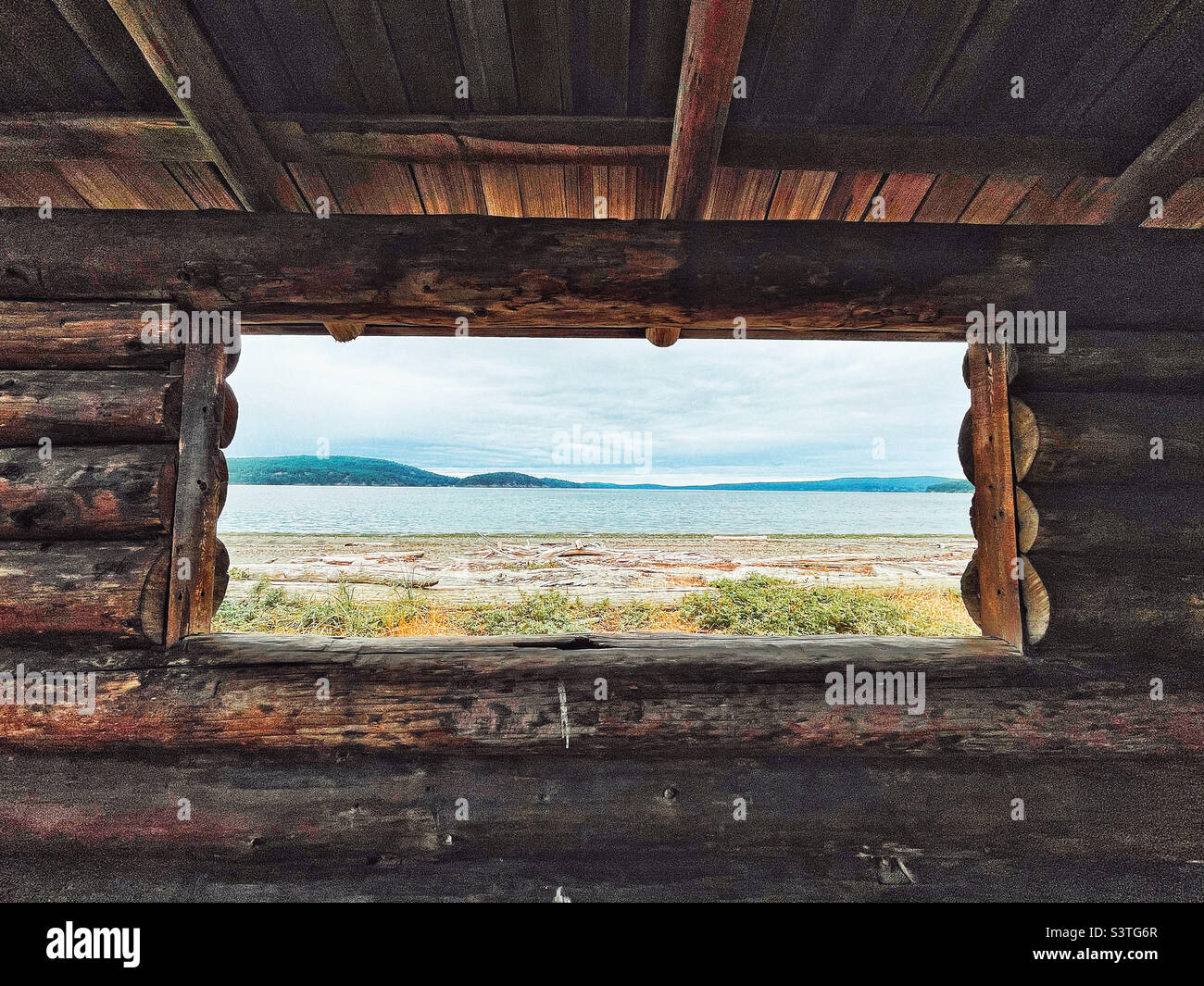 View from rustic log shelter on Spencer Spit Stock Photo