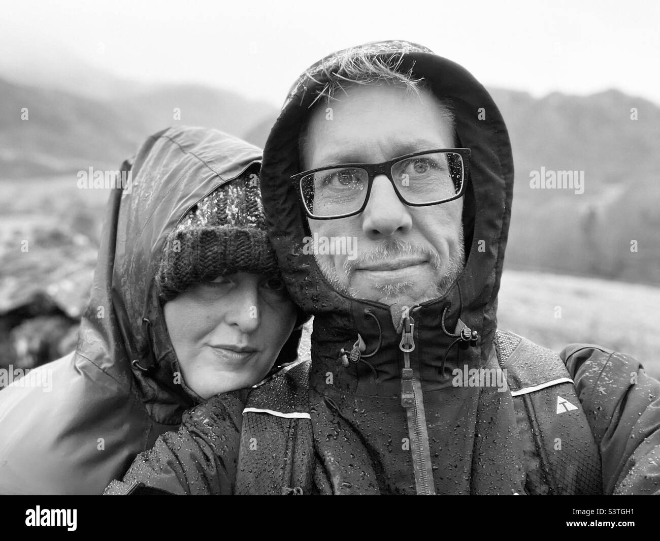 Couple smiling at the camera Stock Photo