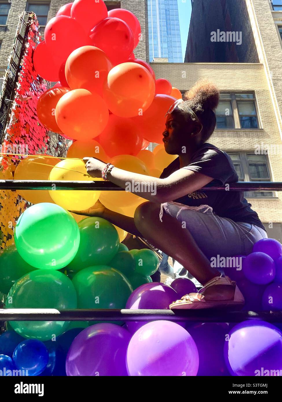 A woman prepping colorful balloons for pride parade in New York City June 26 2022 Stock Photo