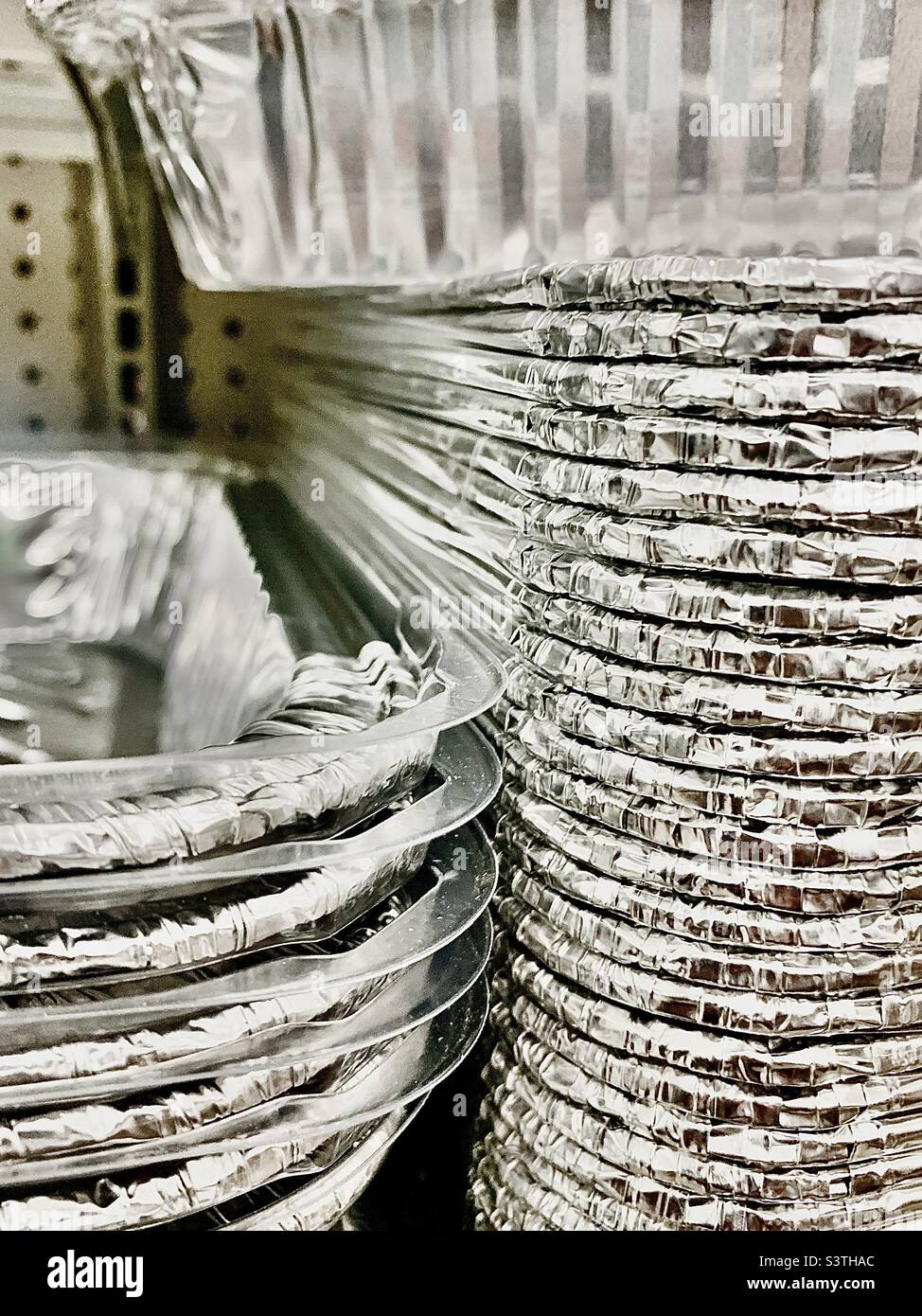 Stack of disposable silver cooking trays Stock Photo