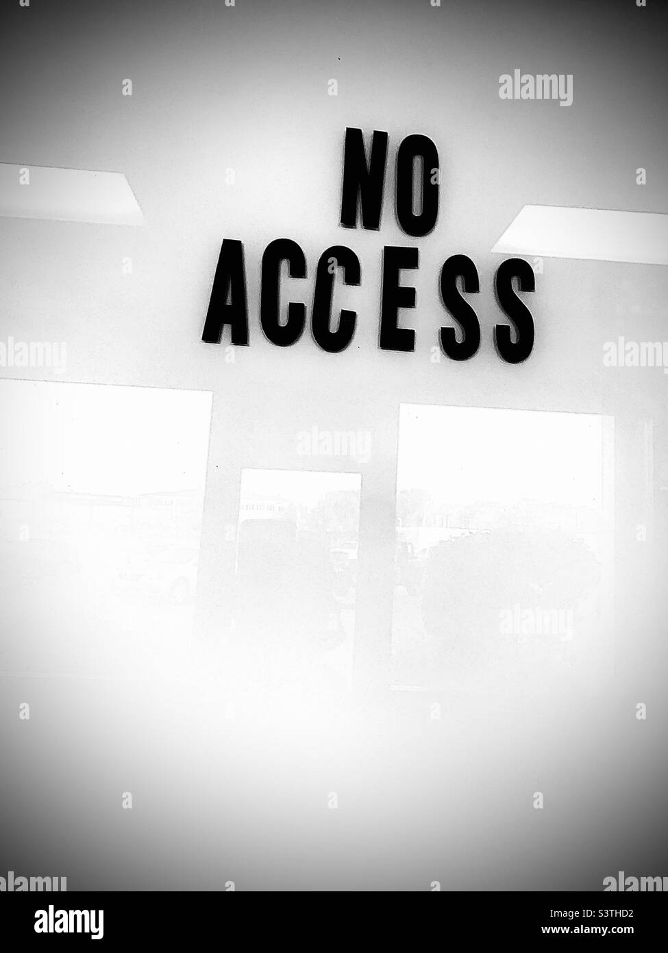 Black and white glossy, NO ACESS sign with reflection Stock Photo