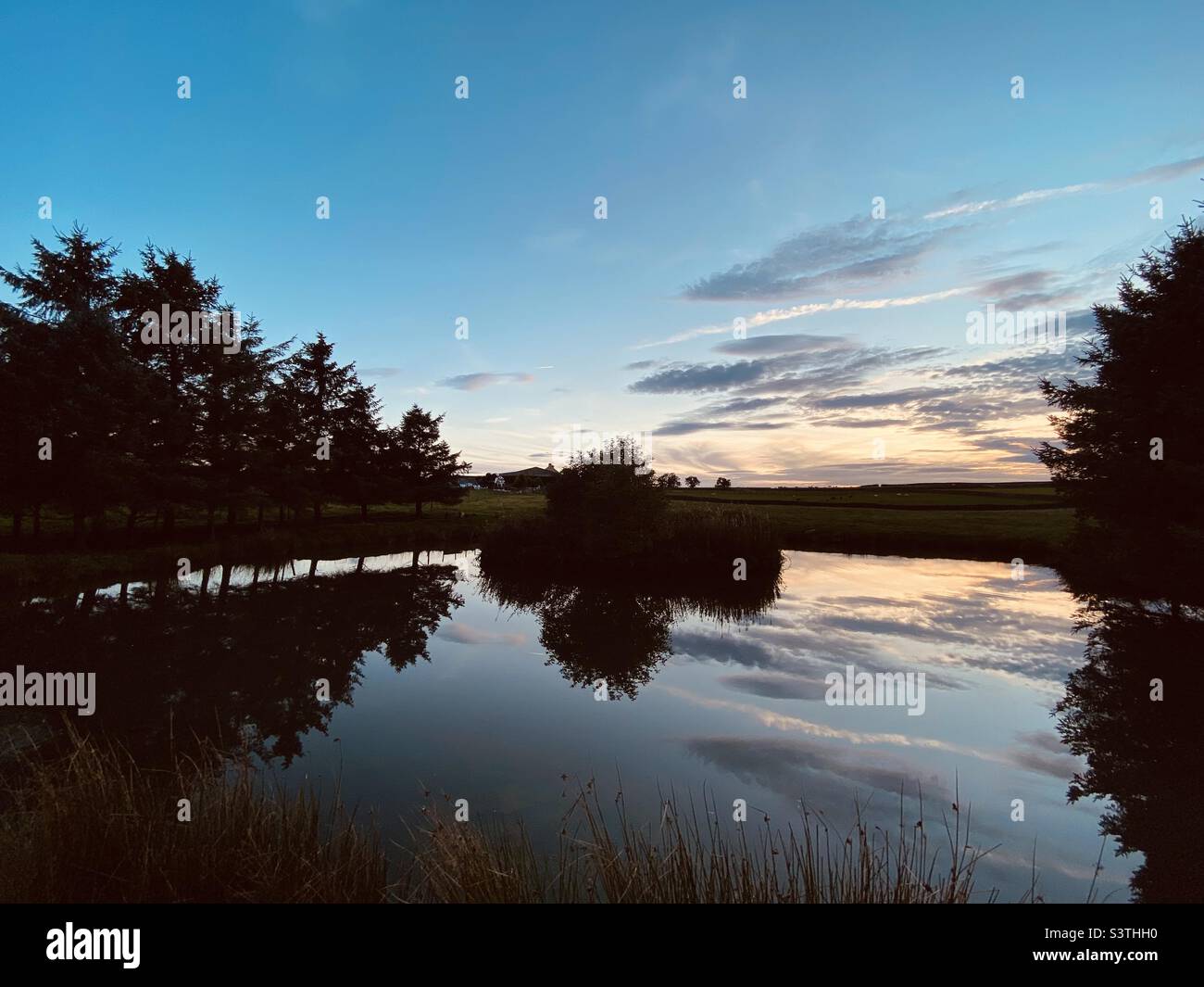 Lake reflections at sunset Stock Photo