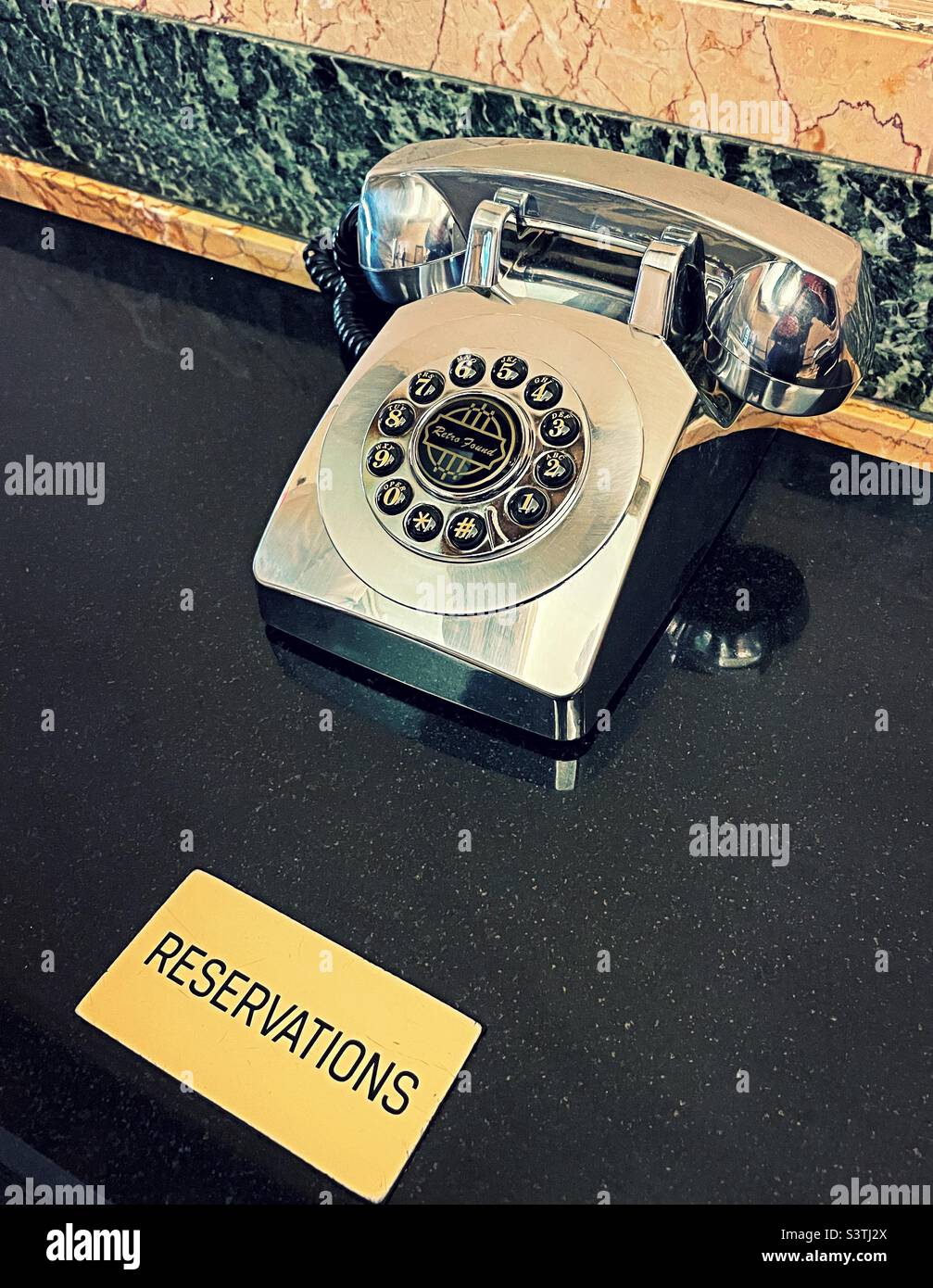 Hotel Edison in Times Square features a silver metallic reservation telephone and it’s lobby, 2022, New York City, USA - Smartphone Captured Stock Image