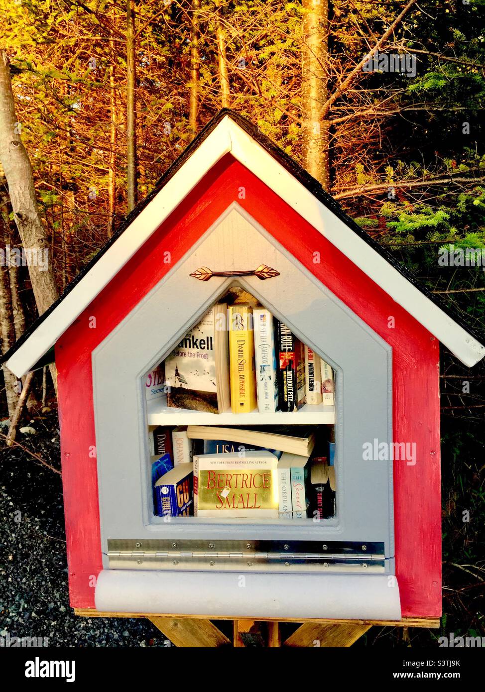 Small, DIY, library, Halifax, Nova Scotia, outside a private home. Free books. Borrowers sometimes swap books, leaving their unwanted books for others. Stock Photo
