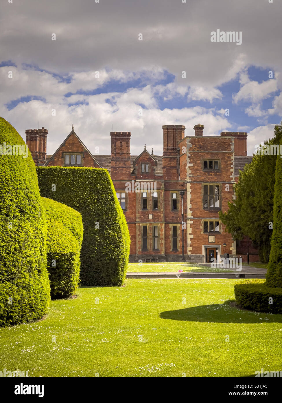 Heslington Hall seen through clipped topiary Yew trees at York