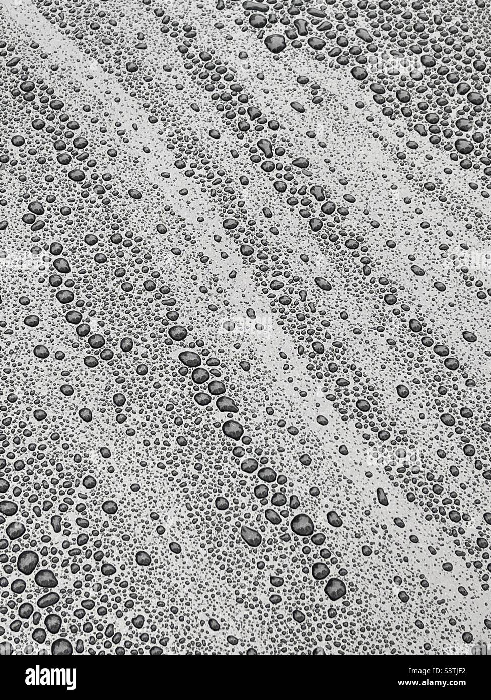 Raindrops on black metal background - Smartphone Captured Stock Image Raindrops on black metal background - Smartphone Captured Stock Image