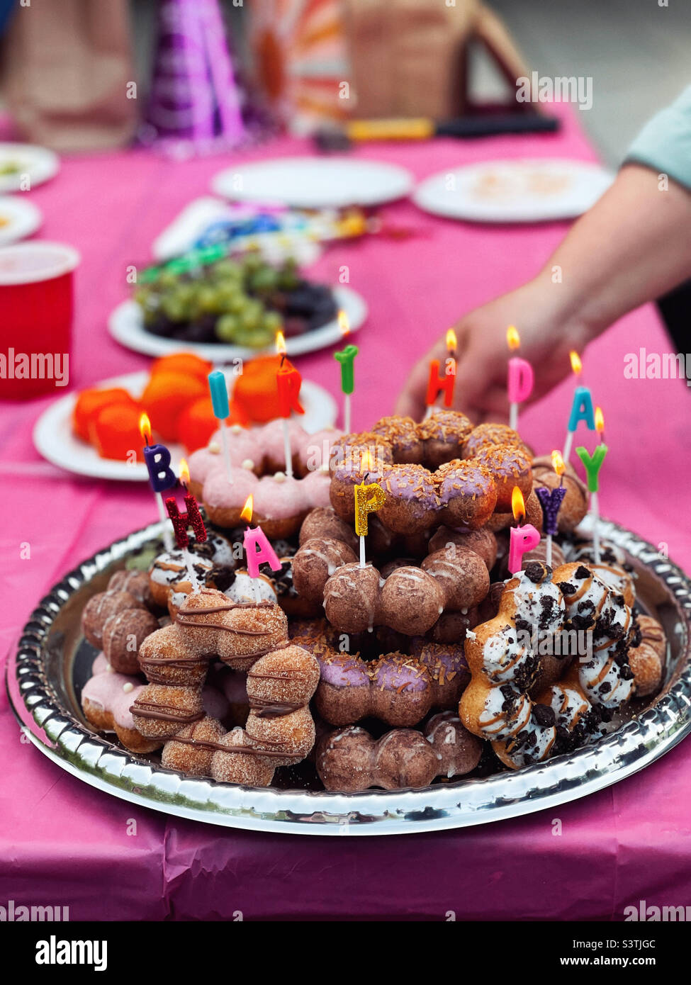 Happy Birthday doughnut cake with candles Stock Photo