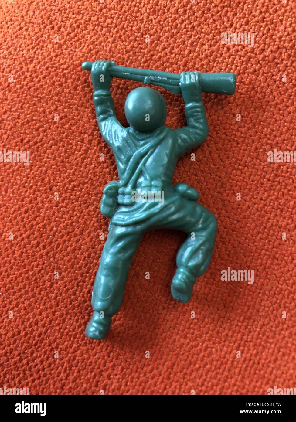 Toy soldier crawling Stock Photo