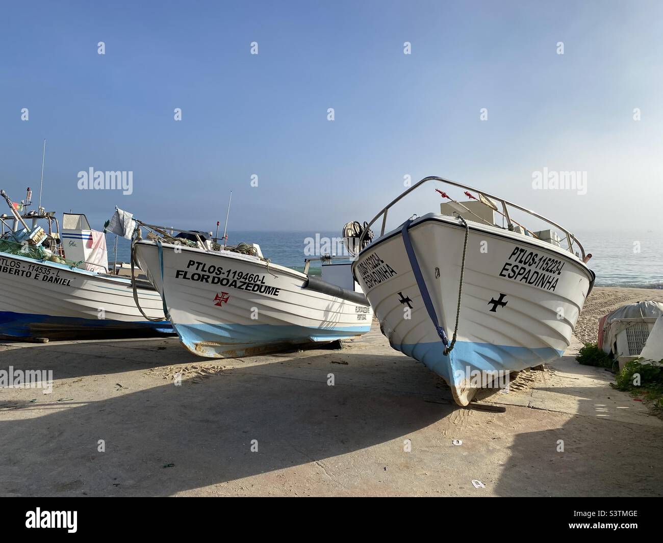 Fishing boats by the beach in Salema, Portugal Stock Photo