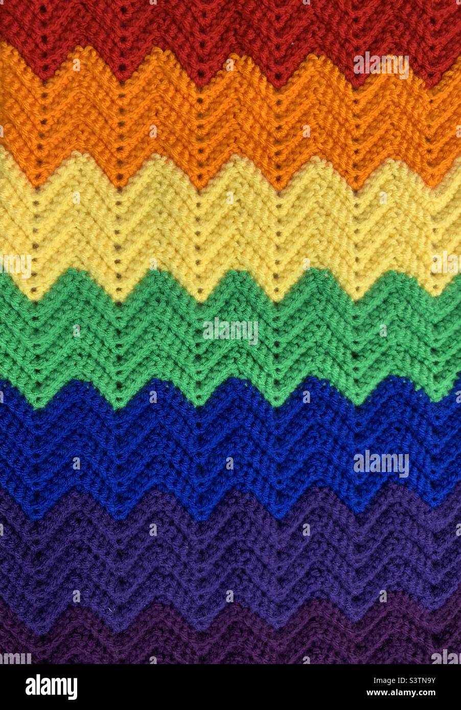 Zig zag crocheted blanket in rainbow colours Stock Photo Alamy