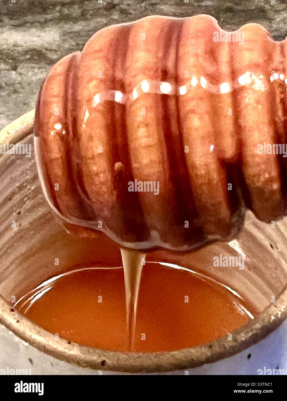 Dripping honey Stock Photo