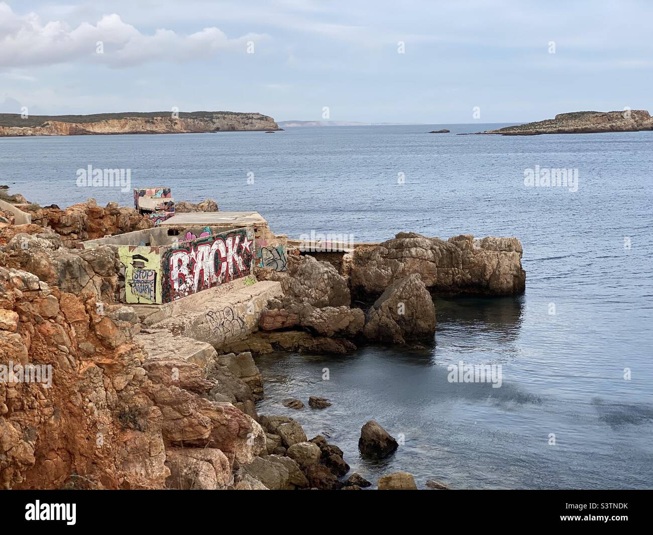 Abandoned building covered in graffiti on the coast near Sagres, Portugal Stock Photo