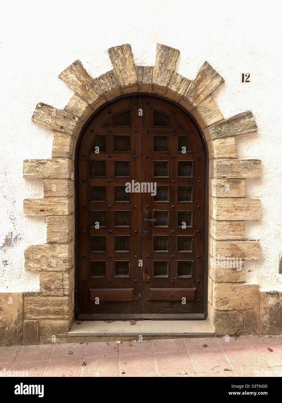 View of a wood spanish door. Traditional design - Smartphone Captured Stock Image