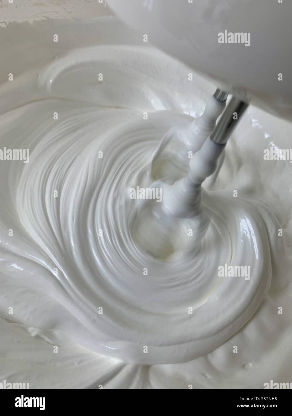 Whisk mixing egg whites to make meringue - Smartphone Captured Stock Image