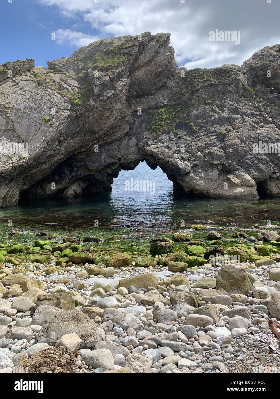Rock arch at Lulworth cove in Dorset Stock Photo