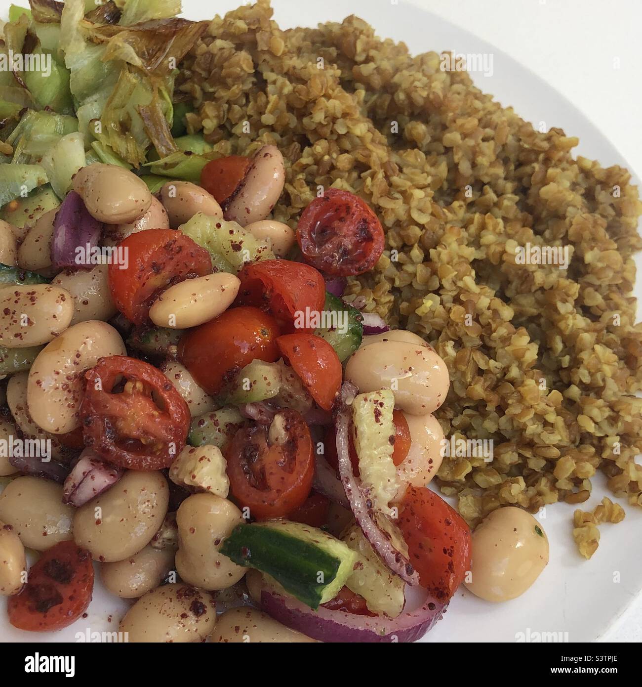 Vegan food , butter bean salad served with bulgur Stock Photo Alamy