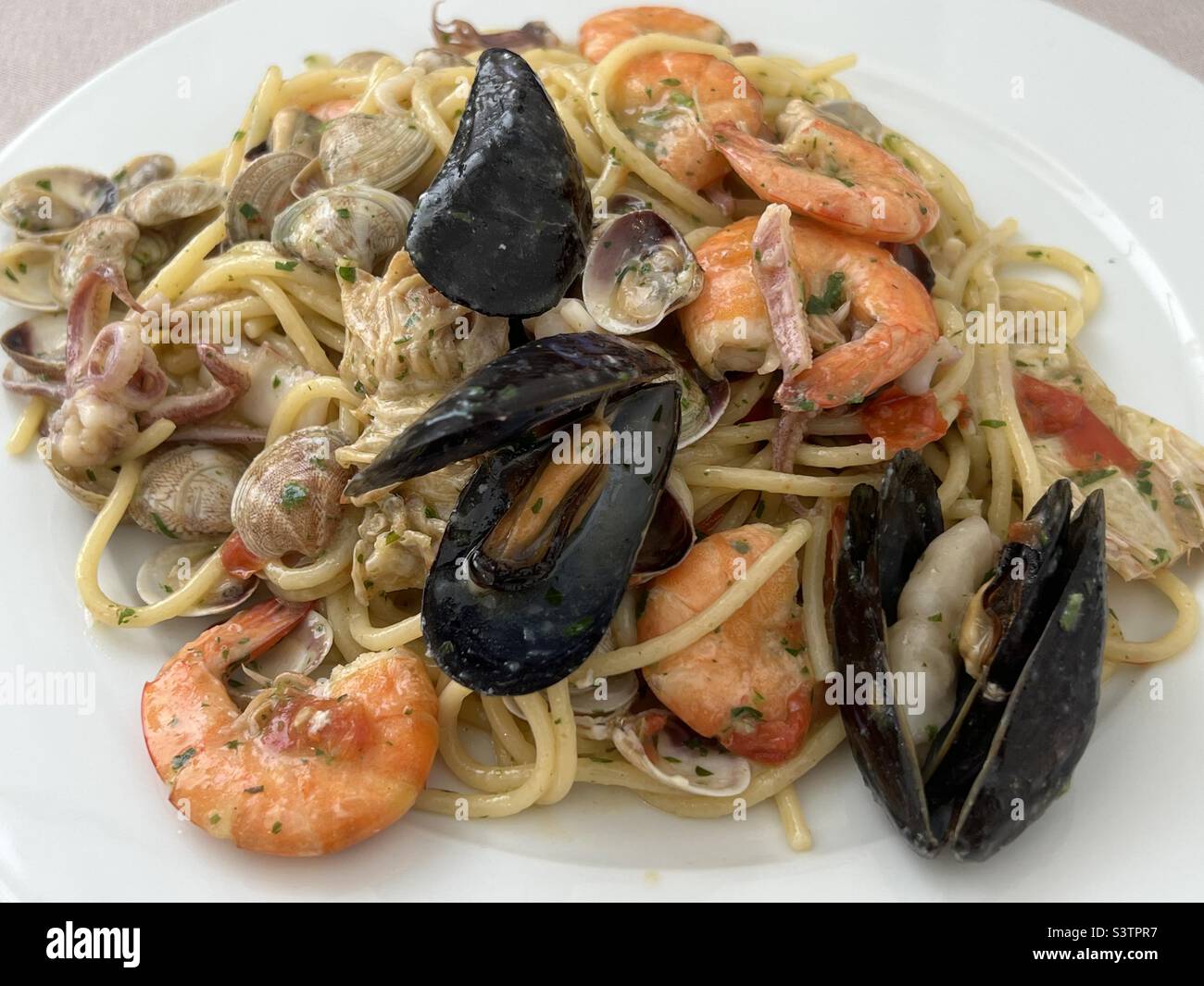 Noodles with seafood at the restaurant Stock Photo