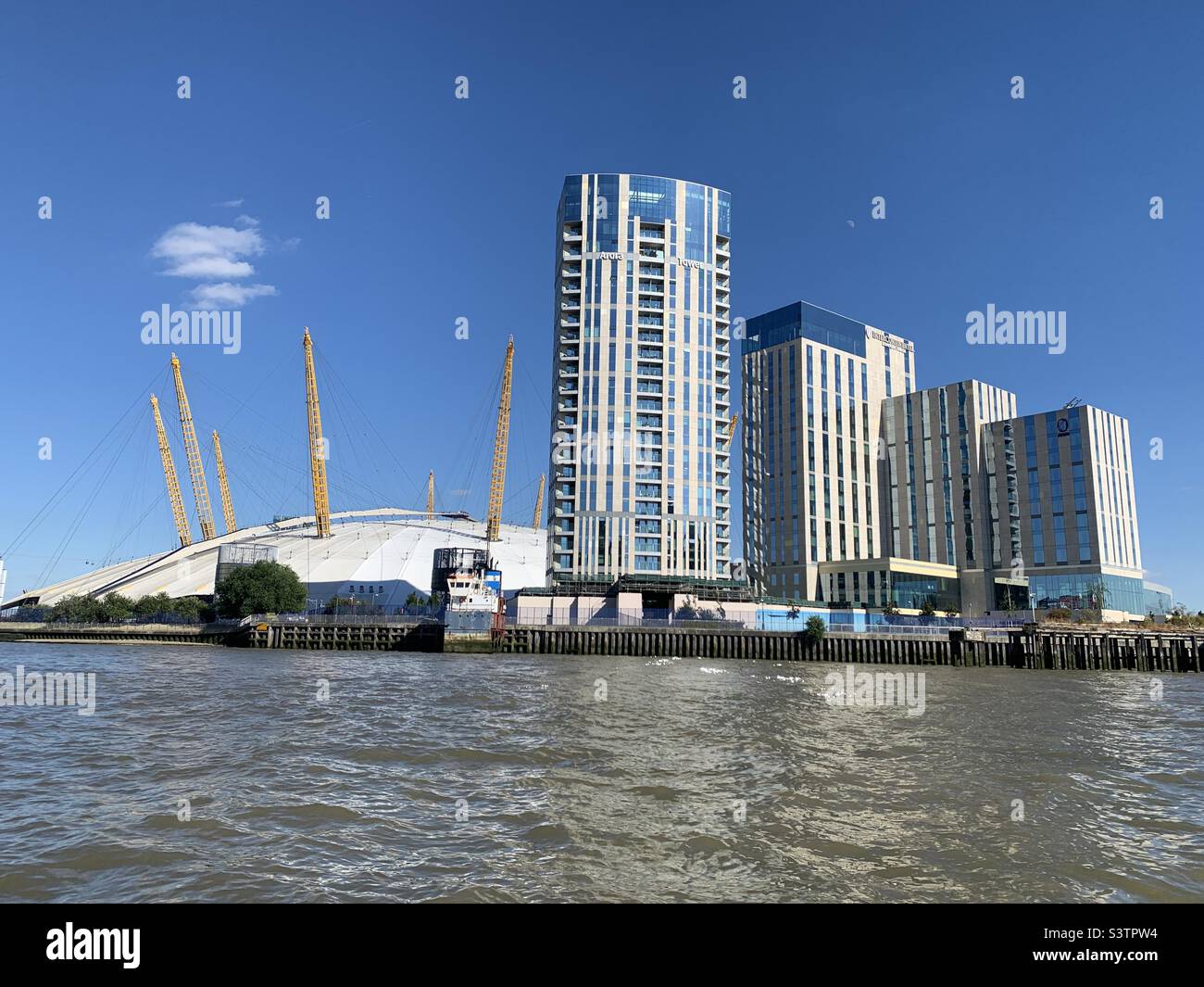 Millennium dome with buildings to one side Stock Photo