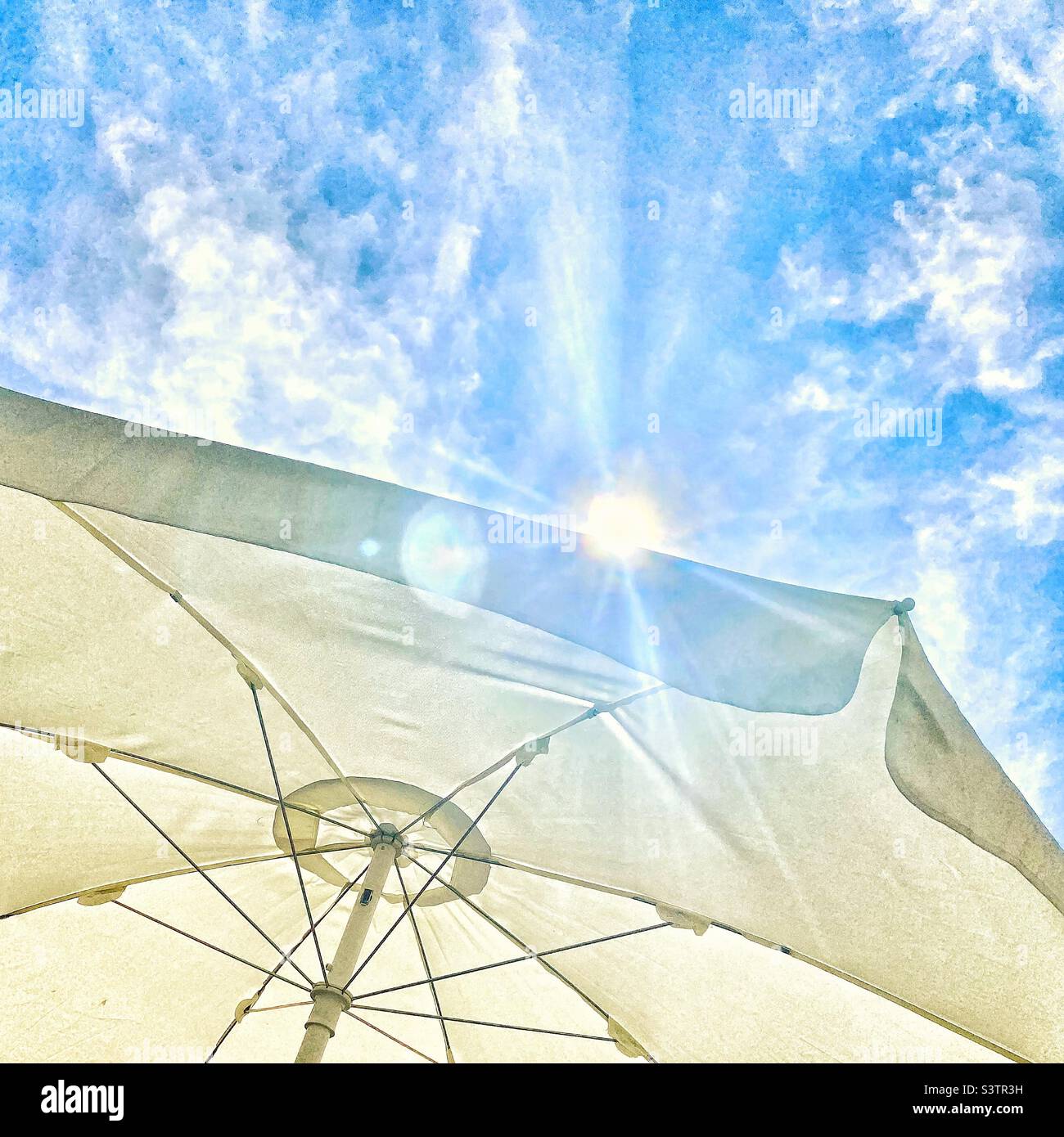 Sun and parasol Stock Photo