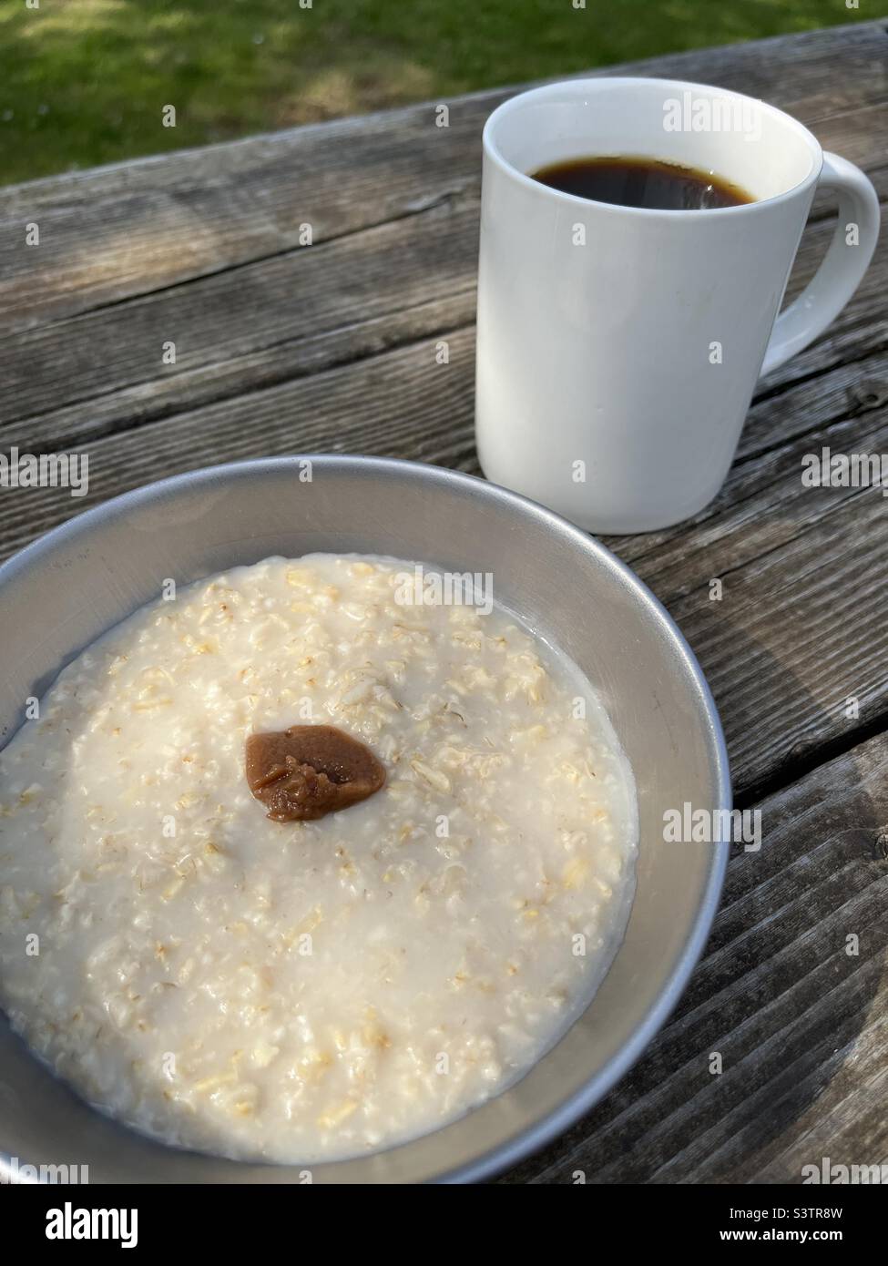 Camp food - coffee and porridge with umeboshi paste - Smartphone Captured Stock Image