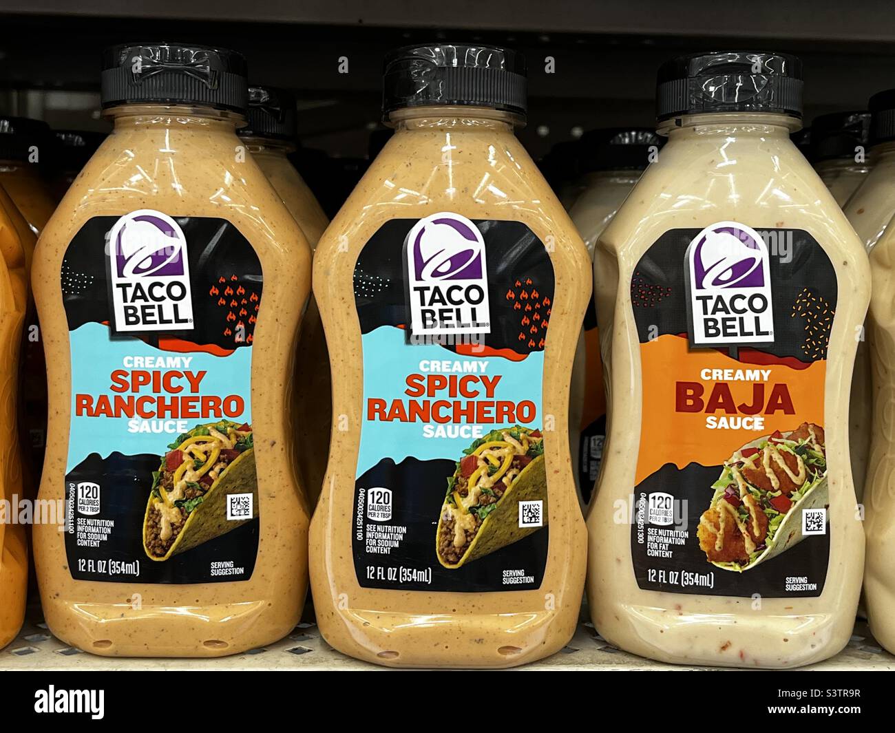 Taco Bell sauce sold in stores. - Smartphone Captured Stock Image