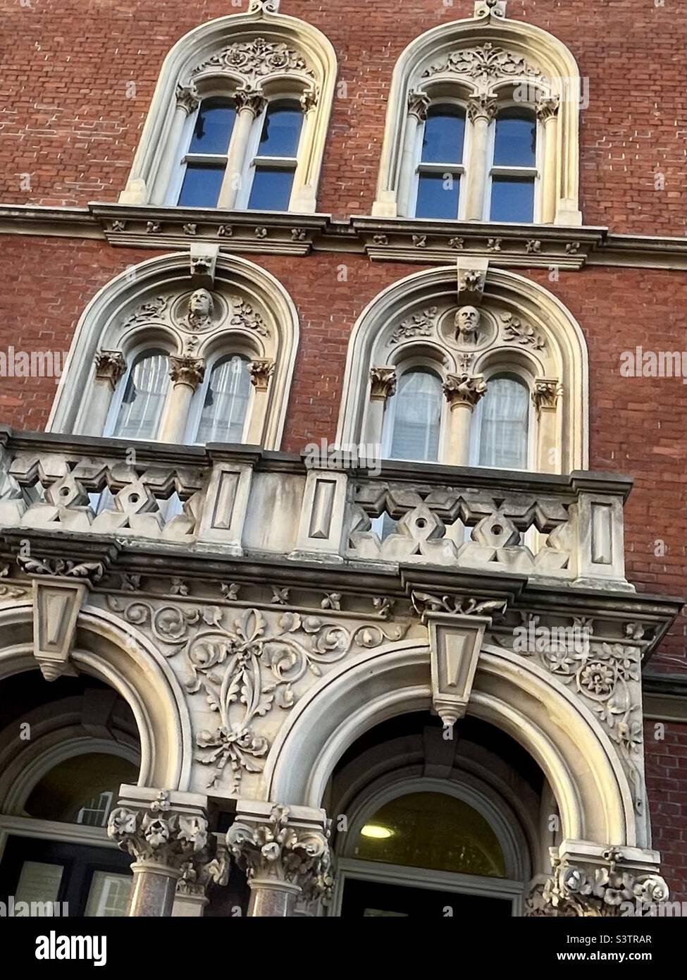 Ghostly busts look out on St Thomas’s Street, Southwark part of Keats House, former building of Guy’s Hospital, London. - Smartphone Captured Stock Image