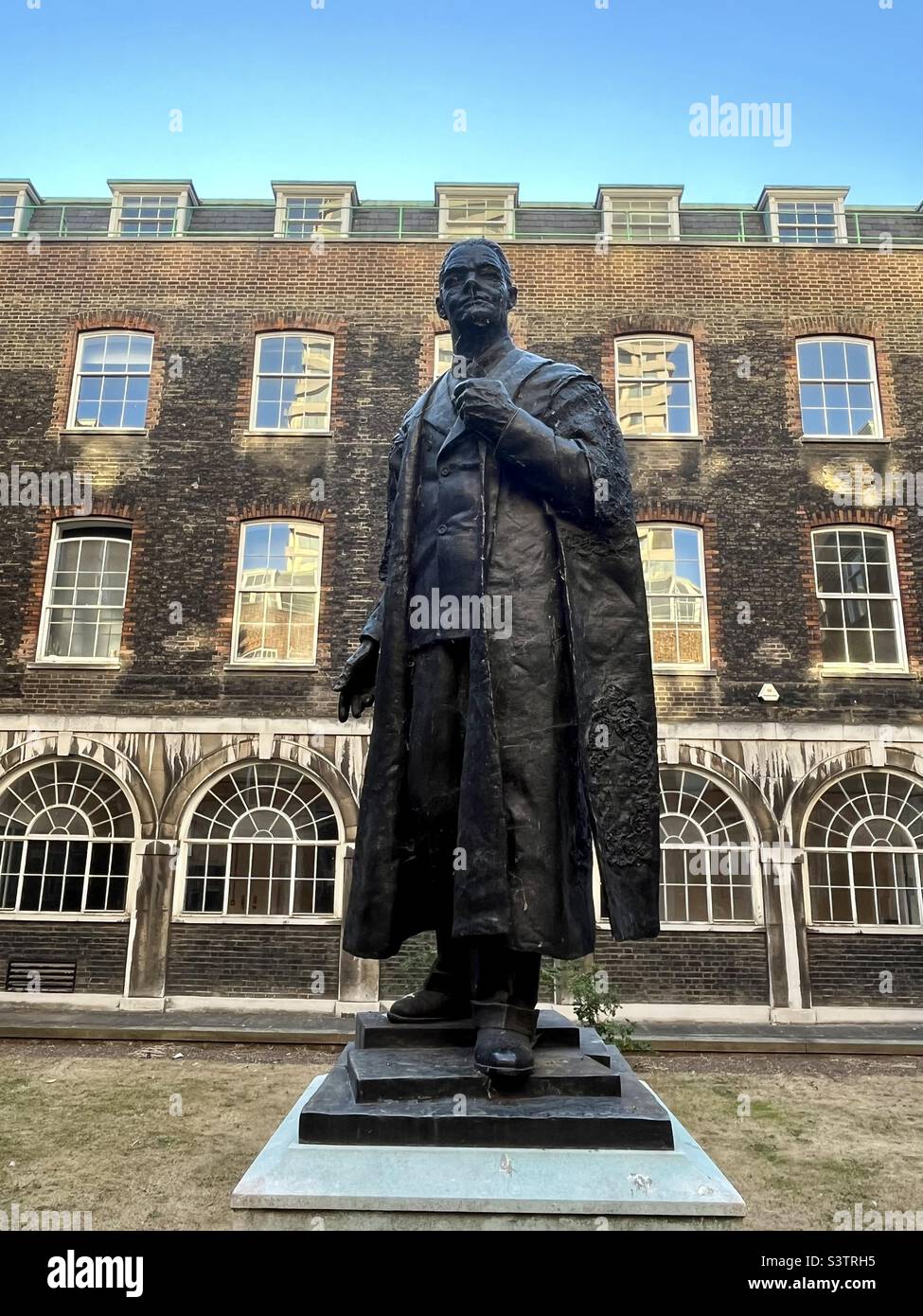 statue of William Morris of the car manufacturers, titled the Viscount Nuffield, in the old courtyard at Guy's Hospital, London in the London Borough of Southwark 2022 - Smartphone Captured Stock Image