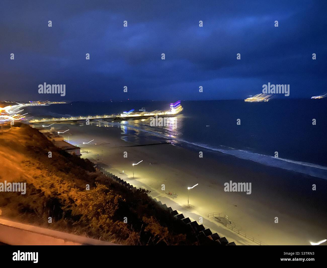 Nighttime lights at the beach Stock Photo Alamy