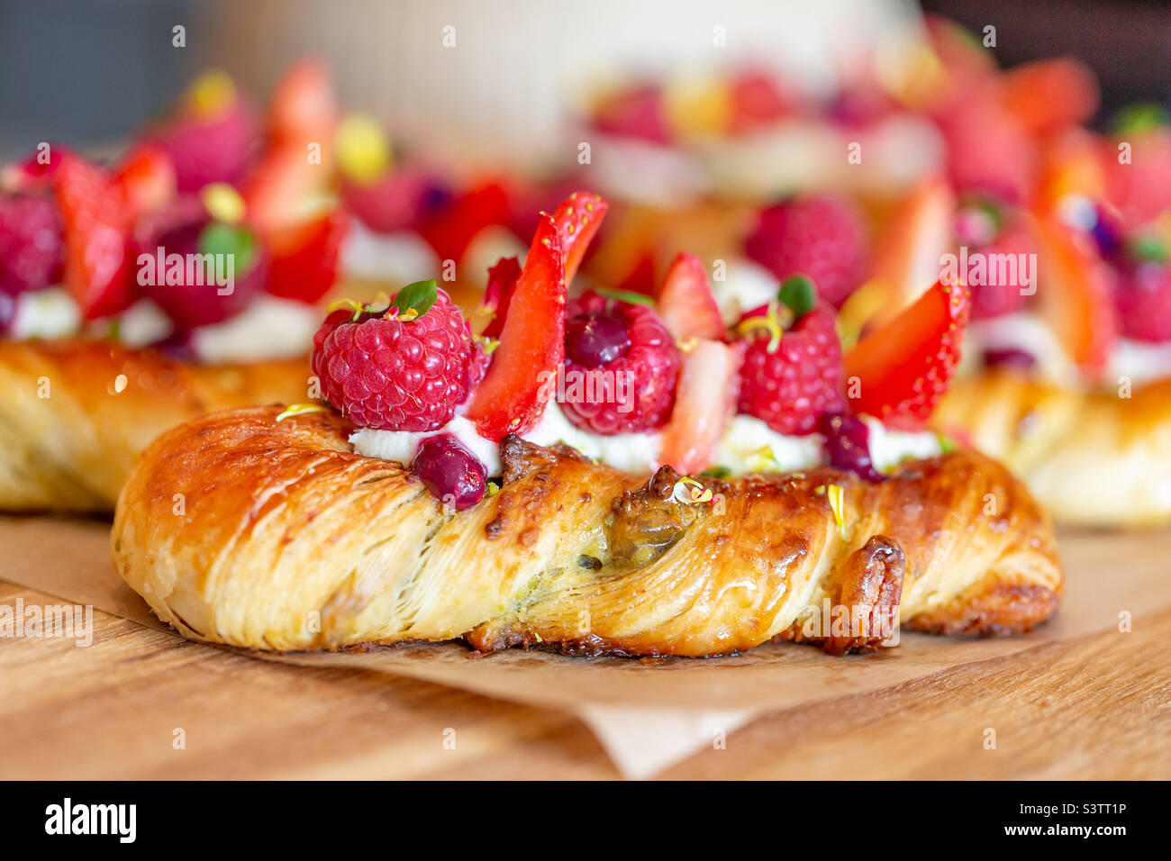 Delicious baked pastry with fresh berries, closeup Stock Photo