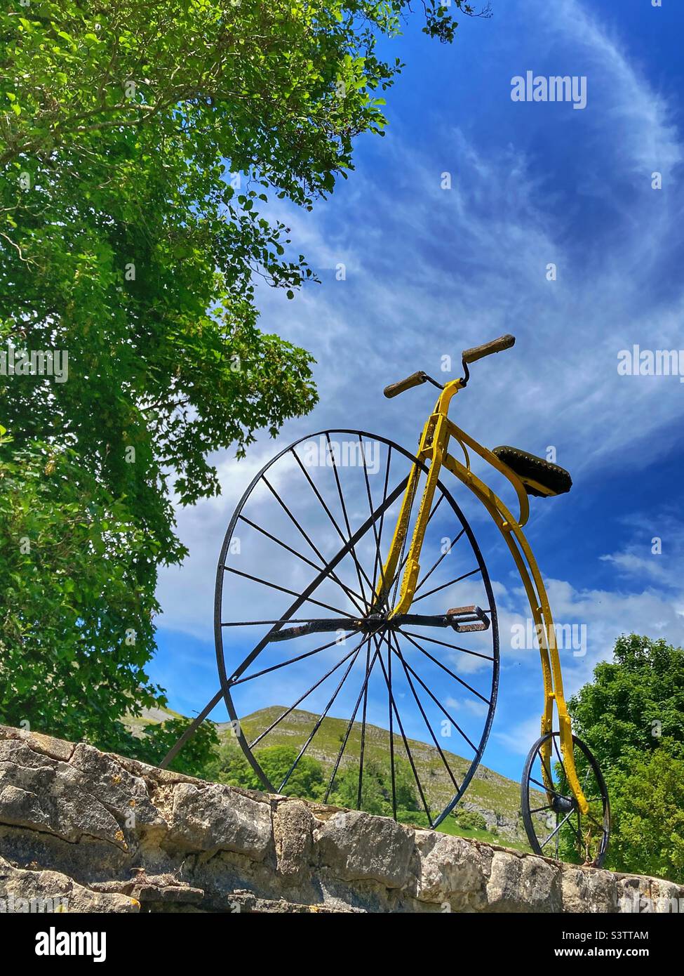 Tour de France Penny Farthing on a wall at Kilnsey in the Yorkshire Dales Stock Photo