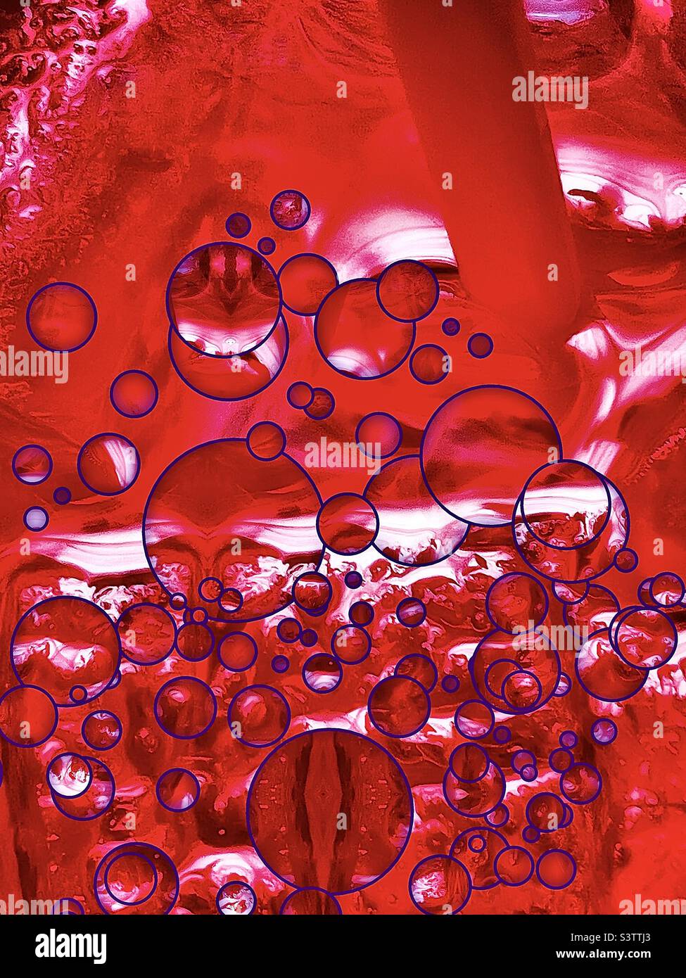 Looking down into a large cup of ice cold cherry sprite. Purple bubbles have been digitally added to the red beverage, straw and ice cubes to make a refreshing abstract. Stock Photo