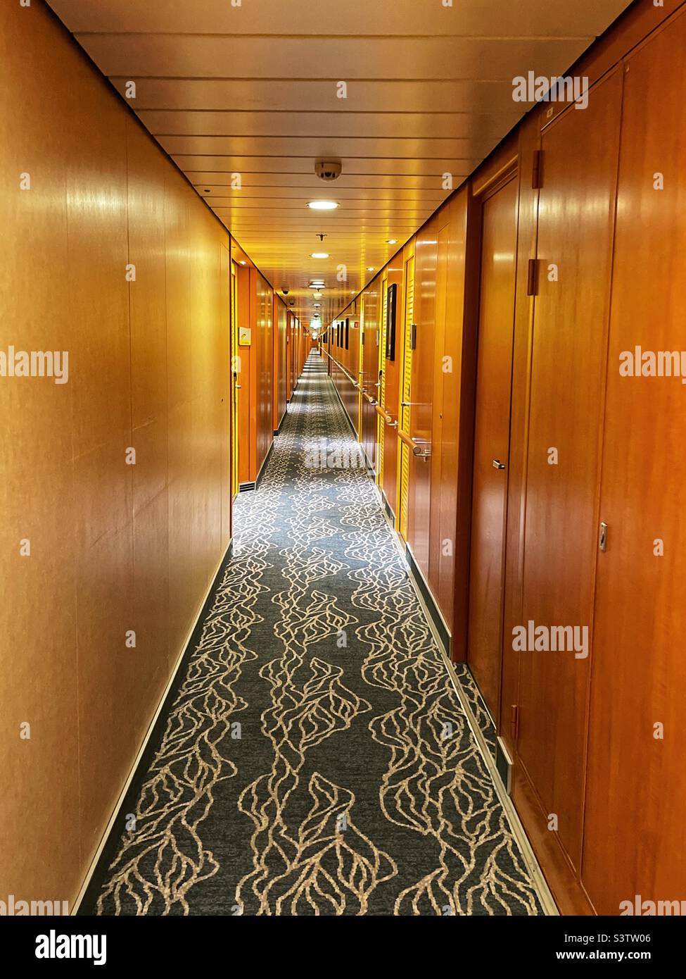 Long corridor on a modern cruise ship. Diminishing perspective. No people. Stock Photo