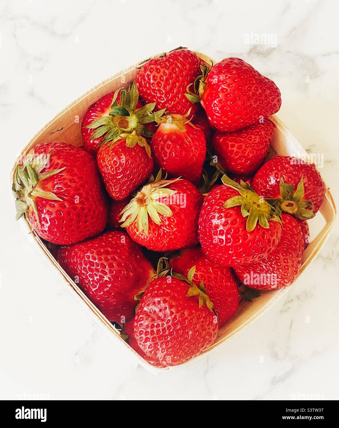 Box of freshly picked farm strawberries. - Smartphone Captured Stock Image