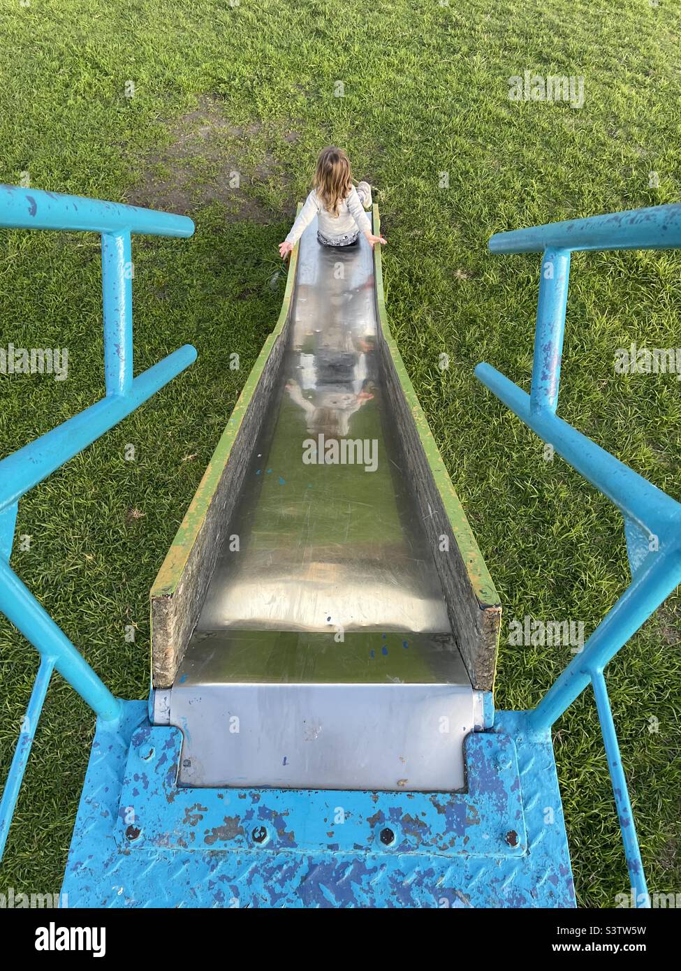 Going down the slide hires stock photography and images Alamy