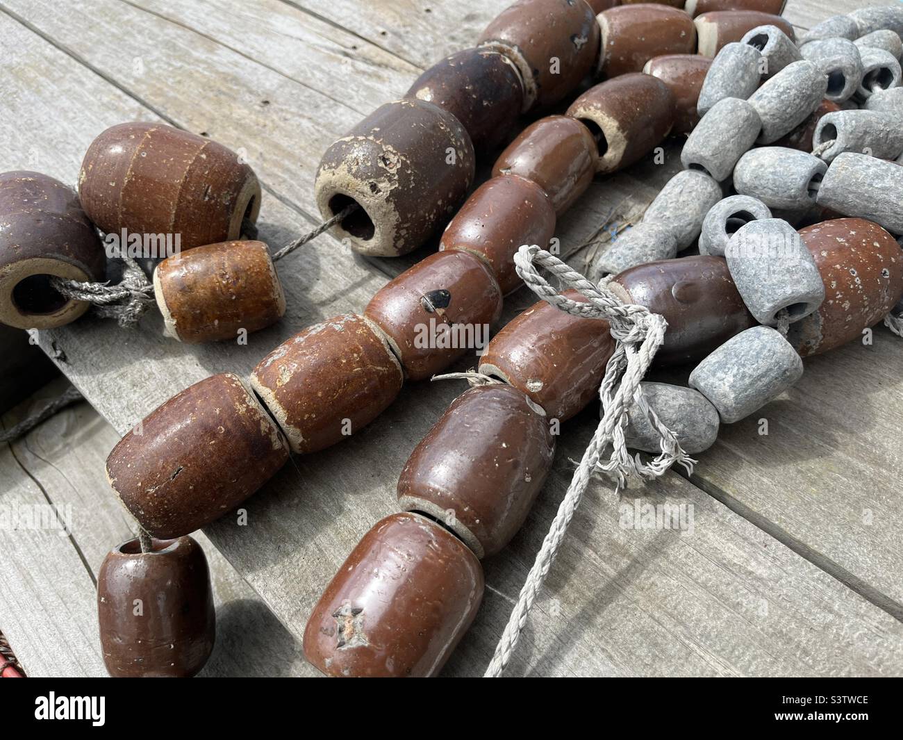 Japanese lead and ceramic fishing weights Stock Photo Alamy