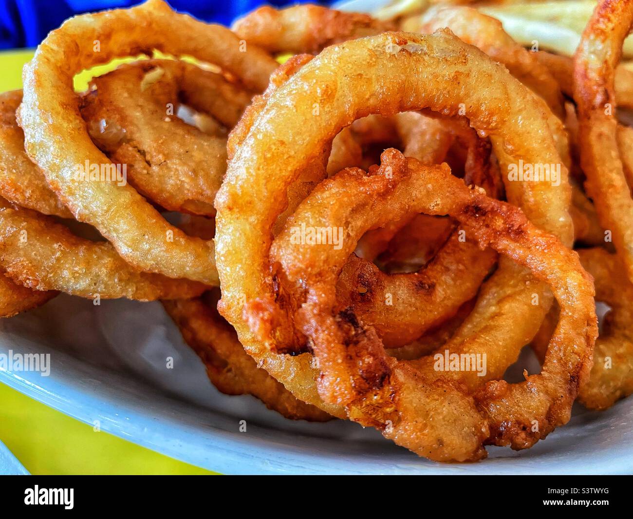 Deep fried batter dipped onion rings. - Smartphone Captured Stock Image