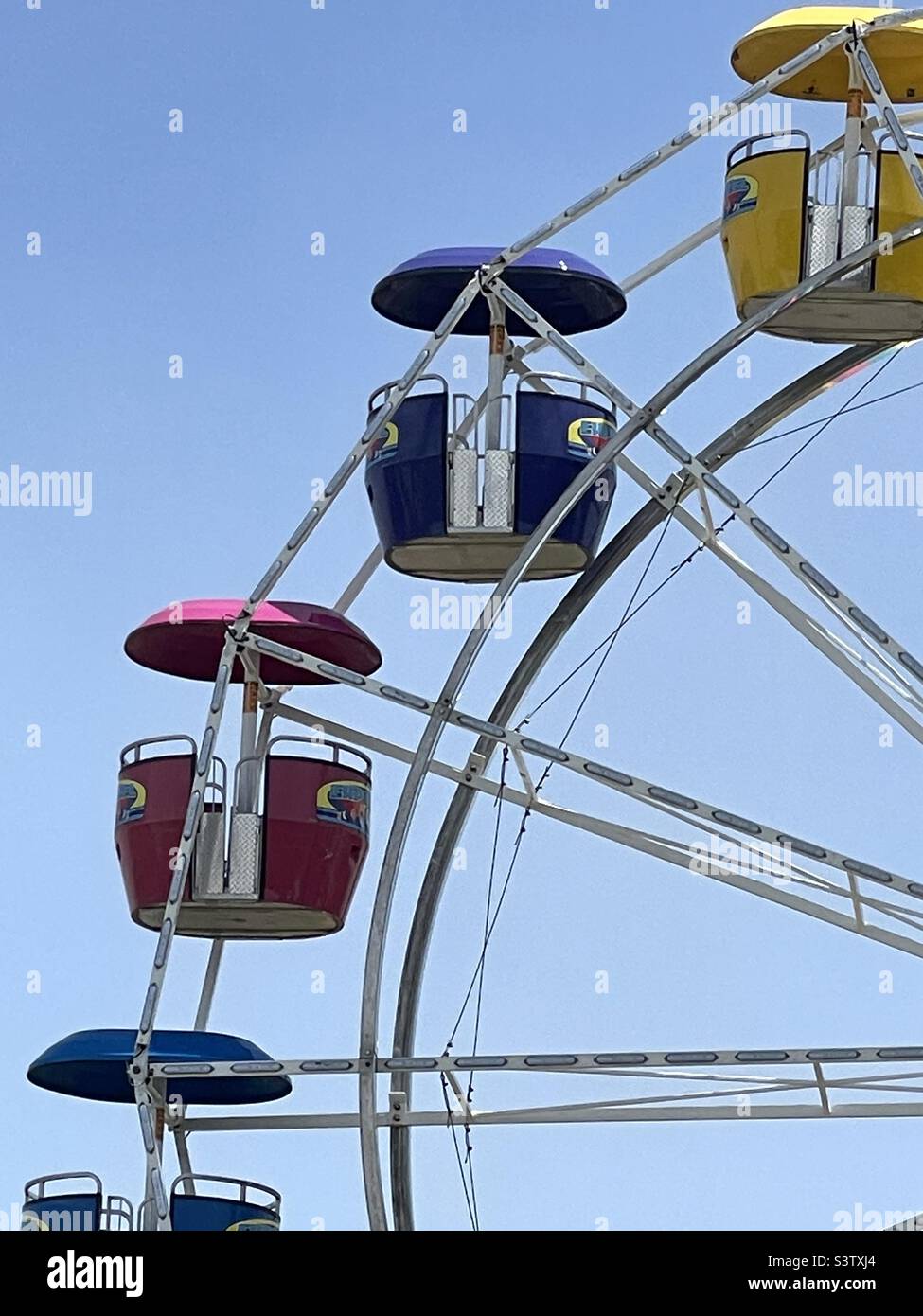 A close view of a Ferris Wheel from a traveling festival being set up in Utah, USA for its’ annual June opening. - Smartphone Captured Stock Image