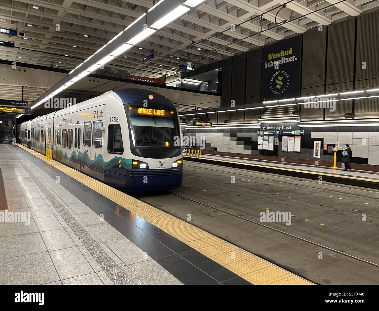 SEATTLE, WA, DEC 2021: modern train pulling into University Street station on light rail system in Downtown - Smartphone Captured Stock Image