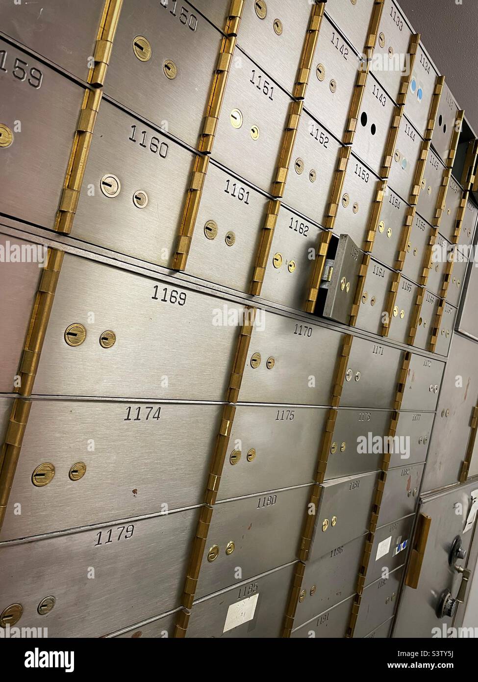 A wall of large safety deposit boxes in a local bank branch Inn Midtown Manhattan, 2022, New York City, USA Stock Photo