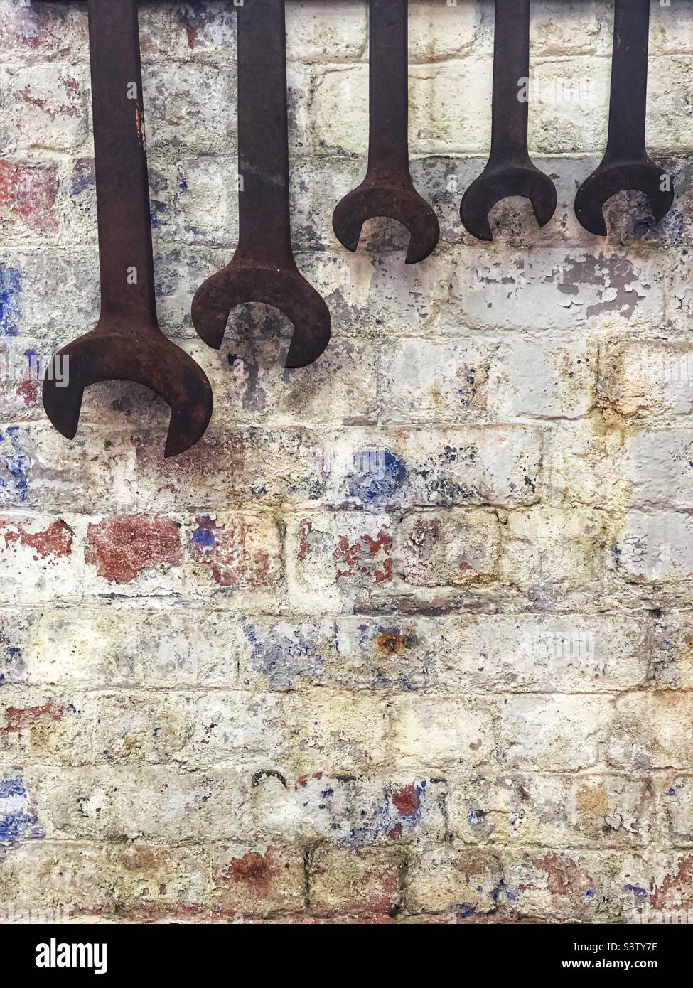 Spanners hanging on wall - Smartphone Captured Stock Image