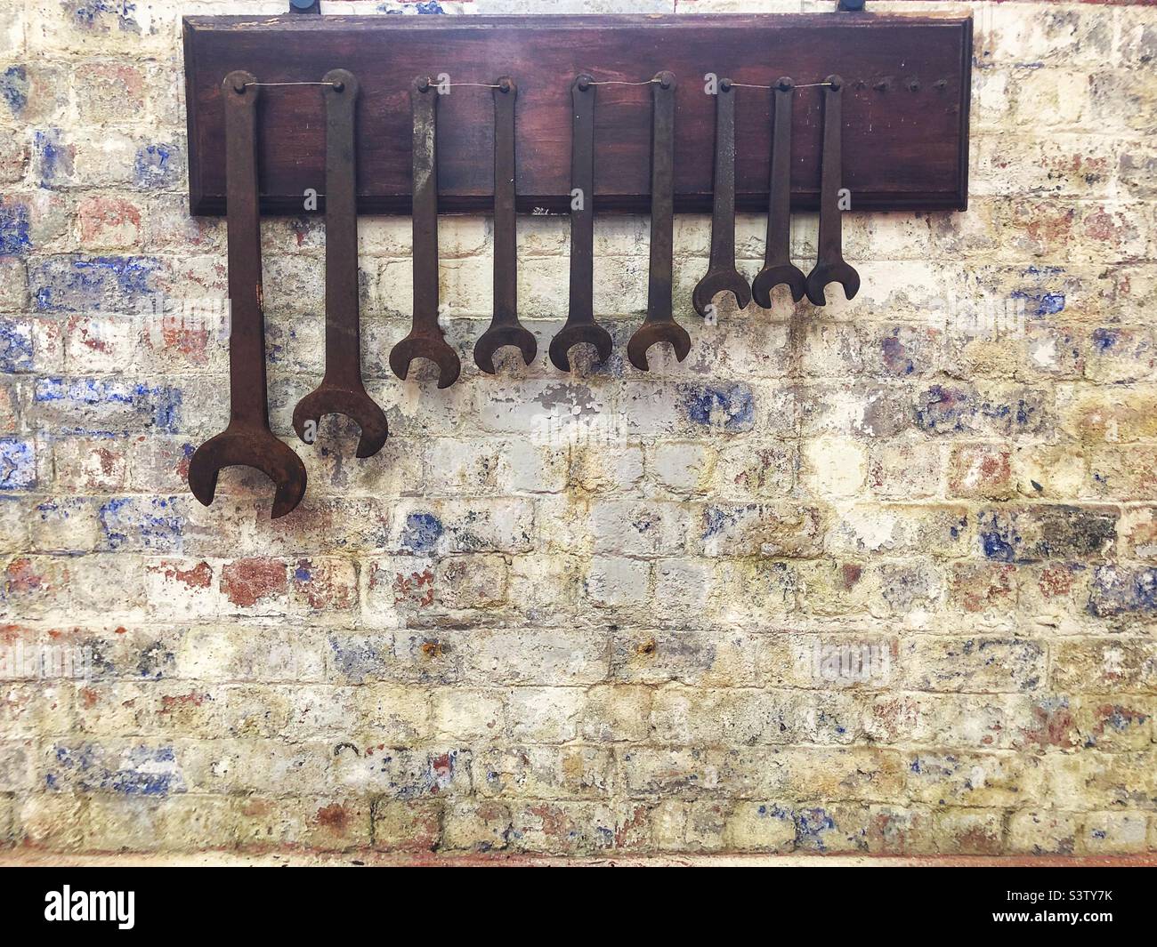 Spanners hanging on wall - Smartphone Captured Stock Image