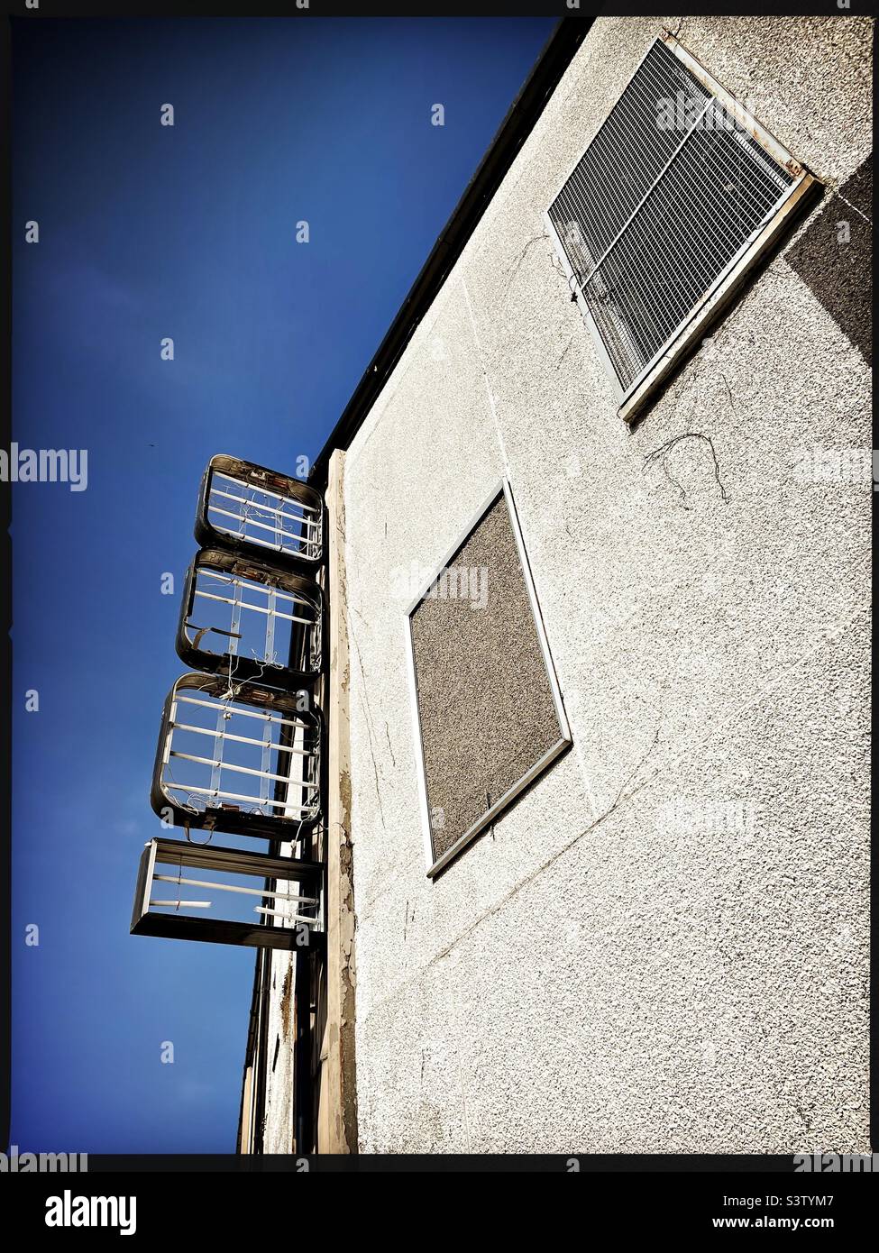 Looking up at a run down empty building on a hot day in summer in Dumfries, Scotland. - Smartphone Captured Stock Image