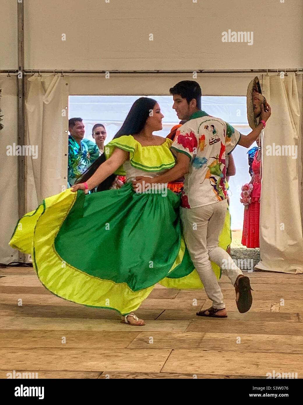 Bolivian couple dancing at performance in London - Smartphone Captured Stock Image